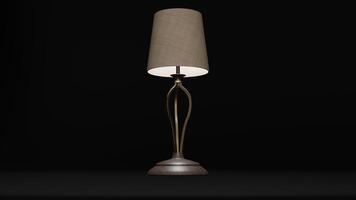 A lamp with a gold base and a shade photo