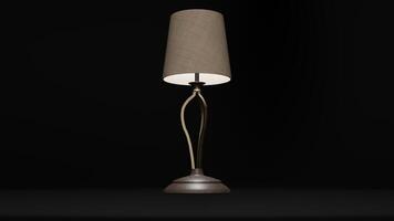A lamp with a gold base and a shade photo