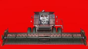 A large combine harvester on a red background photo