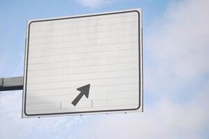 A Blank Directional Road Sign featuring an Arrow, perfect for providing guidance and navigation photo