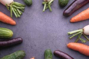 A Vibrant and Colorful Assortment of Fresh Vegetables Beautifully Arranged on a Dark Surface photo