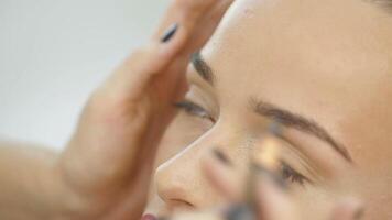 Permanent Tattooing Of Eyebrows. Cosmetologist applying permanent make up on eyebrows video