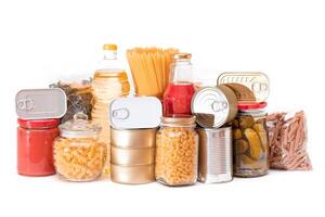 Food Reserves. Canned Food, Spaghetti, Tomato Juice, Pasta and Grocery - Isolated on White Background. Emergency Food Storage in Case of Crisis. Strategic Food Supplies - Isolation photo