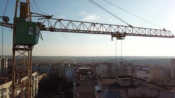 Construction site with tower crane. Construction site with working crane on sky and house district video