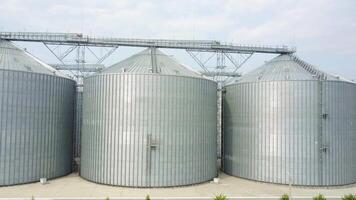 Grain elevator in agricultural zone. Row of granaries for storing wheat and other cereal grains video