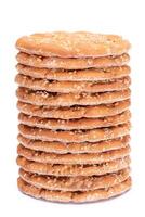 A Stack of Round Salt Crackers with Sesame Isolated on White Background. Dry Snacks - Isolation photo