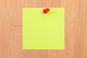 Yellow Sticky Note Pinned to the Wooden Message Board. To Do List Reminder in Office. Blank Memo Sticker at Work - Template. Empty Checklist - Mockup photo