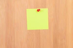 Yellow Sticky Note Pinned to the Wooden Message Board. To Do List Reminder in Office. Blank Memo Sticker at Work - Template. Empty Checklist - Mockup photo