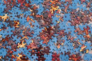 Top View of Mixed Pieces of a Jigsaw Puzzle - Texture Background photo