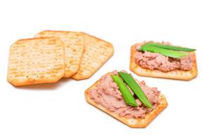 Crispy Salted Cracker with Liver Pate and Green Onions - Isolated on White. Easy Snack - Isolation photo
