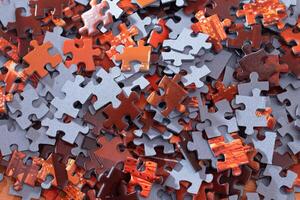 Top View of Mixed Pieces of a Jigsaw Puzzle - Texture Background photo