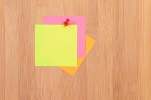 Colored Sticky Notes with Copyspace Pinned to the Wooden Message Board. To Do List Reminder in Office. Blank Memo Sticker at Work - Template. Empty Checklist - Mockup photo