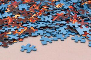 Mixed Pieces of a Colorful Jigsaw Puzzle - Strategy and Solving Problem Concept photo