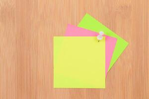 Colored Sticky Notes with Copyspace Pinned to the Wooden Message Board. To Do List Reminder in Office. Blank Memo Sticker at Work - Template. Empty Checklist - Mockup photo