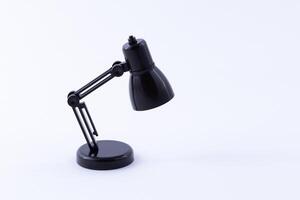 Table Lamp Mini Model. Small Black Desk Lamp on White Background photo