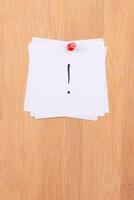 White Sticky Notes with Exclamation Point Pinned to the Wooden Message Board. To Do List Reminder in the Office. Memo Note at Work photo