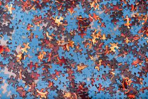 Top View of Mixed Pieces of a Jigsaw Puzzle - Texture Background photo