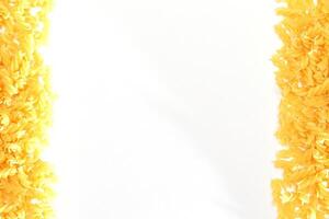 Uncooked Fusilli Pasta with Copy Space on White Background. Raw and Dry Macaroni. Fat and Unhealthy Food - Flat Lay photo