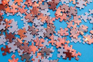 Top View of Mixed Pieces of a Jigsaw Puzzle - Texture Background photo