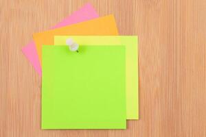 Colored Sticky Notes with Copyspace Pinned to the Wooden Message Board. To Do List Reminder in Office. Blank Memo Sticker at Work - Template. Empty Checklist - Mockup photo