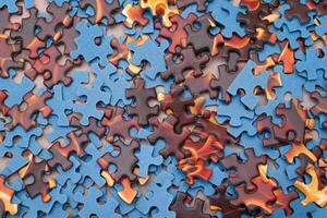 Top View of Mixed Pieces of a Jigsaw Puzzle - Texture Background photo