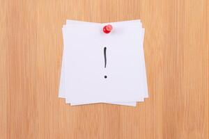 White Sticky Notes with Exclamation Point Pinned to the Wooden Message Board. To Do List Reminder in the Office. Memo Note at Work photo
