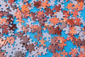 Top View of Mixed Pieces of a Jigsaw Puzzle - Texture Background photo