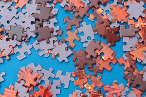 Top View of Mixed Pieces of a Jigsaw Puzzle - Texture Background photo