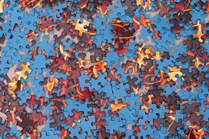 Top View of Mixed Pieces of a Jigsaw Puzzle - Texture Background photo