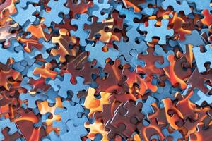 Top View of Mixed Pieces of a Jigsaw Puzzle - Texture Background photo