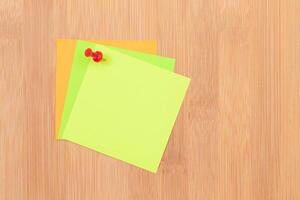Colored Sticky Notes with Copyspace Pinned to the Wooden Message Board. To Do List Reminder in Office. Blank Memo Sticker at Work - Template. Empty Checklist - Mockup photo