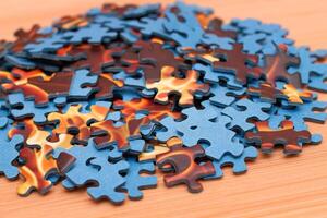 Colorful Pieces of a Mixed Jigsaw Puzzle Lie on the Wooden Table - Strategy and Solving Problem Concept photo