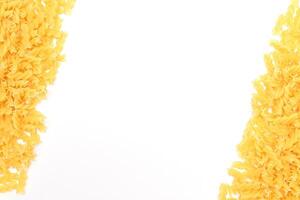 Uncooked Fusilli Pasta with Copy Space on White Background. Raw and Dry Macaroni. Fat and Unhealthy Food - Flat Lay photo