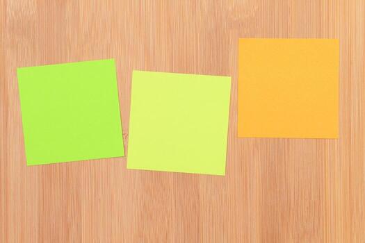 Colored Sticky Notes with Copyspace Pinned to the Wooden Message Board. To Do List Reminder in Office. Blank Memo Sticker at Work - Template. Empty Checklist - Mockup photo