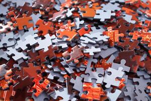 Top View of Mixed Pieces of a Jigsaw Puzzle - Texture Background photo