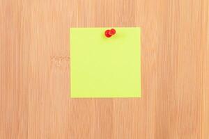 Yellow Sticky Note Pinned to the Wooden Message Board. To Do List Reminder in Office. Blank Memo Sticker at Work - Template. Empty Checklist - Mockup photo