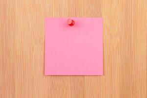 Pink Sticky Note Pinned to the Wooden Message Board. To Do List Reminder in Office. Blank Memo Sticker at Work - Template. Empty Checklist - Mockup photo