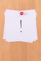 White Sticky Notes with Exclamation Point Pinned to the Wooden Message Board. To Do List Reminder in the Office. Memo Note at Work photo