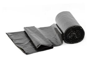 Black Polyethylene Garbage Bags on White Background - Close-Up. The Roll of Plastic Junk Package photo