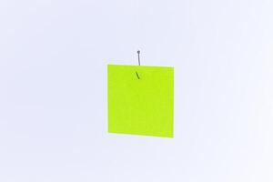 Mockup of a Blank Green Memo Paper with Copy Space Hanging on a Fishing Hook Against the White Background. Reminder or To Do List. Sticky Note Template photo
