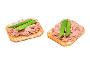 Crispy Salted Cracker with Liver Pate and Green Onions - Isolated on White. Easy Snack - Isolation photo