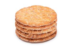 A Stack of Round Salt Crackers with Sesame Isolated on White Background. Dry Snacks - Isolation photo