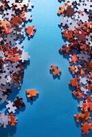 Mixed Pieces of a Colorful Jigsaw Puzzle Lie on the Blue Background - Strategy and Solving Problem Concept photo