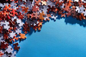 Mixed Pieces of a Colorful Jigsaw Puzzle Lie on the Blue Background With Copy Space - Strategy and Solving Problem Concept photo