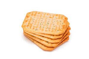 Stack of Crispy Salted Crackers with Greens - Isolated on White. Easy Snack - Isolation photo