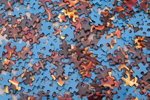 Top View of Mixed Pieces of a Jigsaw Puzzle - Texture Background photo