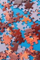 Top View of Mixed Pieces of a Jigsaw Puzzle - Texture Background photo