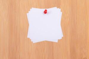 White Sticky Notes with Copyspace Pinned to the Wooden Message Board. To Do List Reminder in Office. Blank Memo Stickers at Work - Template. Empty Checklist - Mockup photo