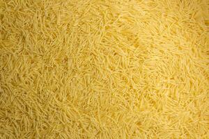 Uncooked Filini Pasta. A Culinary Canvas of Noodles, Creating a Lively and Textured Background for Gourmet Cooking. Dry Pasta. Raw Macaroni - Top View, Flat Lay photo