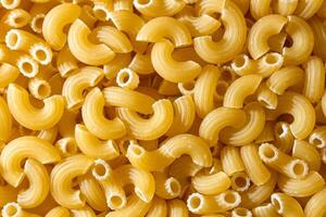 Uncooked Chifferi Rigati Pasta. A Culinary Canvas of Chifferi Rigati, Creating a Lively and Textured Background for Gourmet Cooking. Dry Pasta. Raw Macaroni - Top View, Flat Lay photo